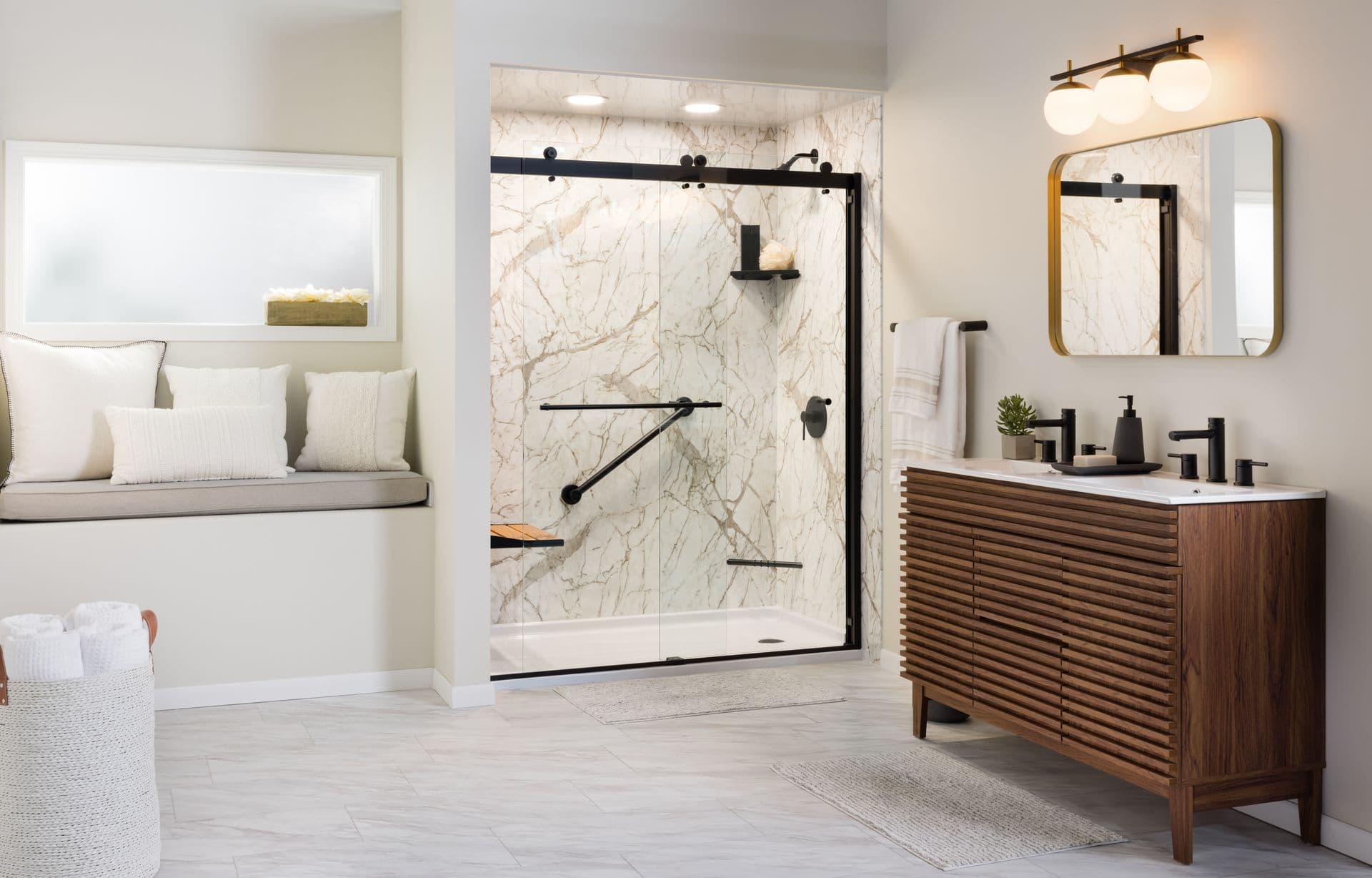 A contemporary bathroom featuring a marble shower with black fixtures, a wooden vanity, and a window seat.